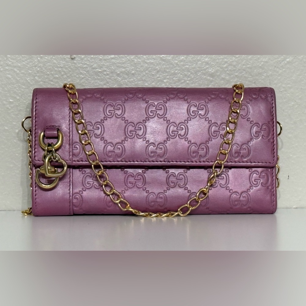 Authentic Gucci wallet with heart charm